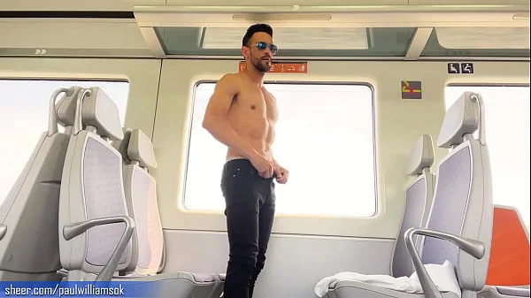 Sexy tanned man travelling naked by train. Very risky public nudity